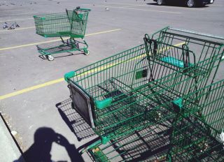 High Angle View Of Shopping Cart On Parking Lot