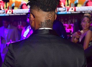 Usher shows new neck tattoo at Party For Usher producer Keith Thomas