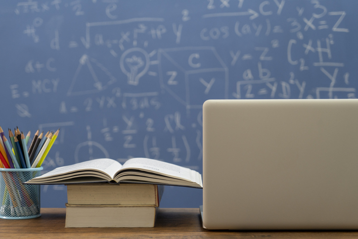 School books on desk, education concept