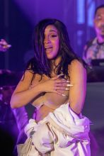 Cardi B Performs in a Bathrobe at Bonaroo after Busting Open Dior Sequined jumpsuit