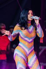 Cardi B Performs in a Bathrobe at Bonaroo after Busting Open Dior Sequined jumpsuit
