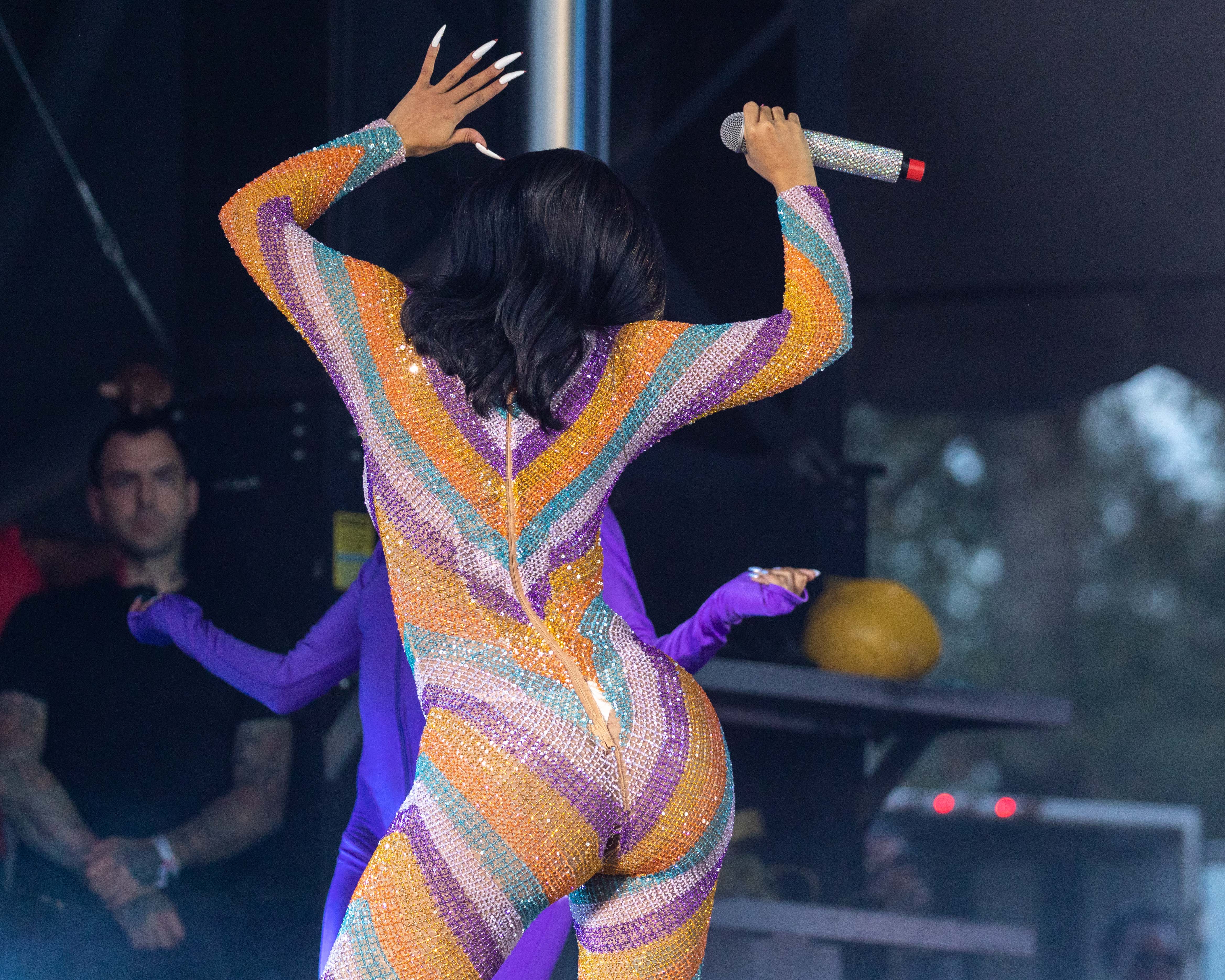 Performs in a Bathrobe at Bonaroo after Busting Open Dior Sequined jumpsuit