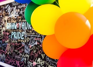Show your pride chalk board with messages and balloons
