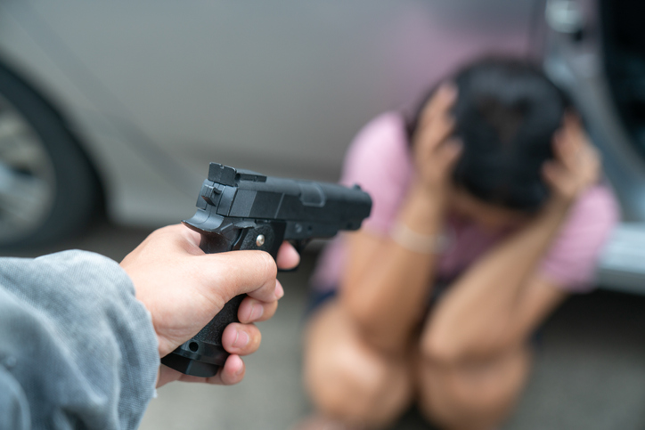 Cropped Hand Shooting Woman With Handgun