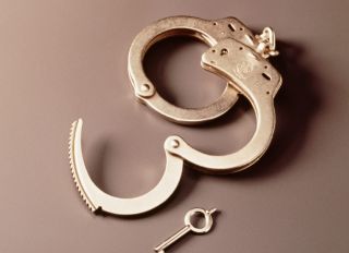 LAW & JUSTICE WITH OPEN HAND CUFFS WITH KEY