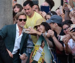 Brad Pitt poses with fans at the Once Upon A Time In Hollywood Premiere