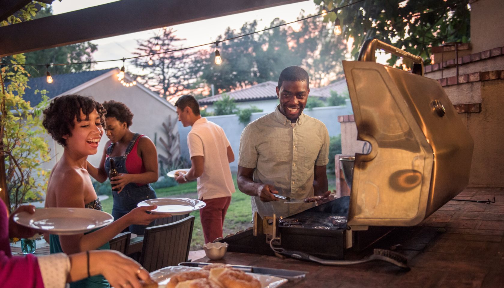Hipsters Grilling at a Summer Backyard BBQ