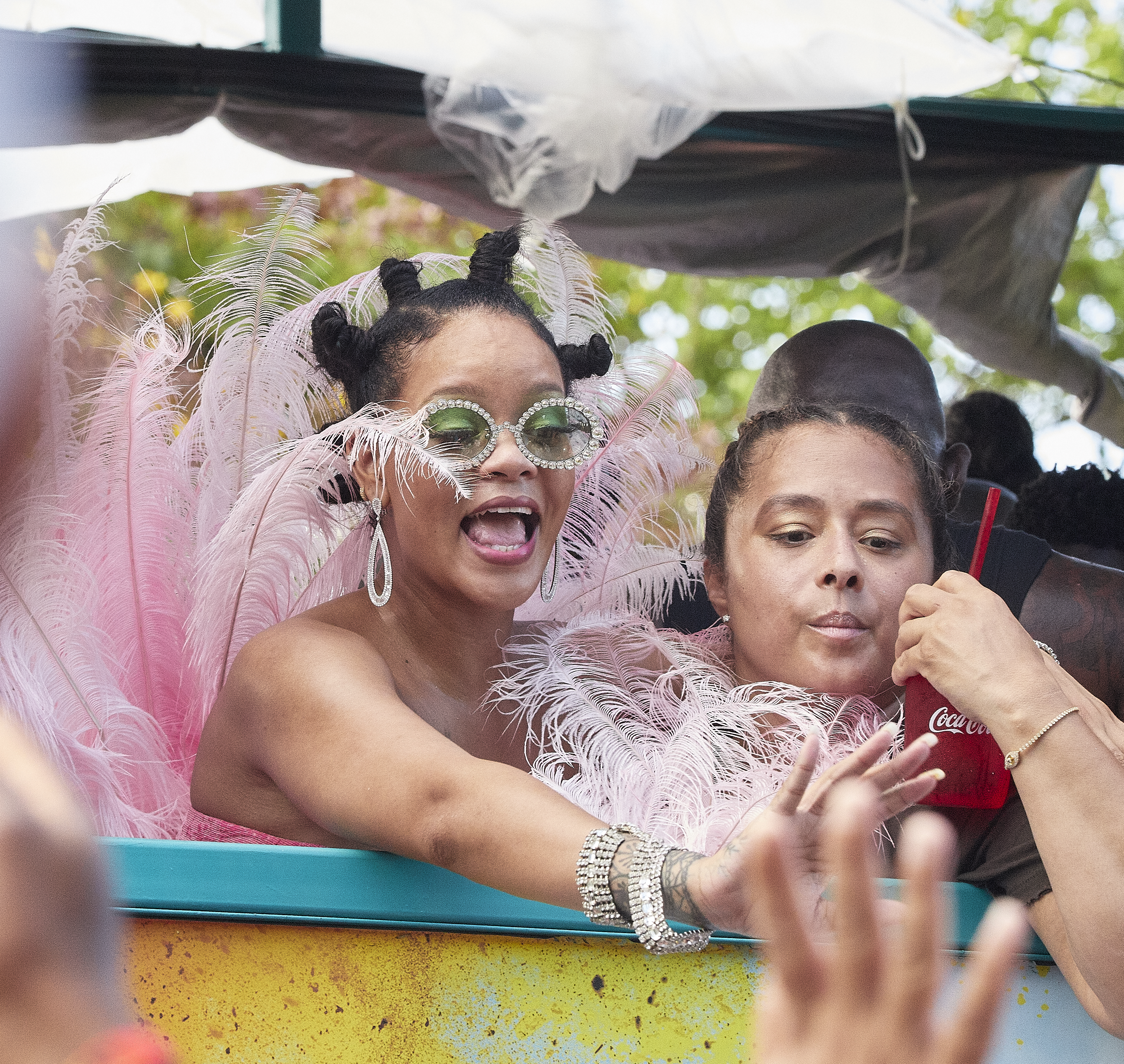 Rihanna wears pink feathers to Cropover
