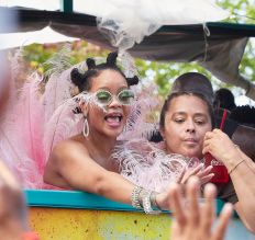 Rihanna wears pink feathers to Cropover