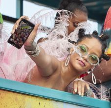 Rihanna wears pink feathered costume to Cropover