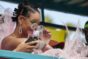 Rihanna wears pink feathered costume to Cropover