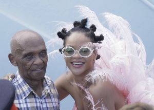 Rihanna wears pink feathered costume to Cropover