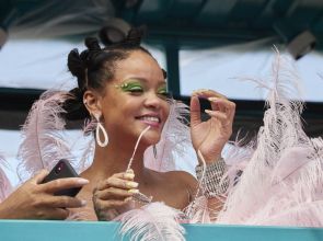 Rihanna wears pink feathered costume to Cropover
