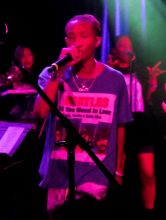 Jaden Smith surprises fans as he jumps up on stage with Willow Smith during her performance at The Roxy