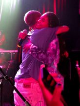 Jaden Smith surprises fans as he jumps up on stage with Willow Smith during her performance at The Roxy