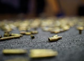 USA: Expended ammo casings at a booth during the National...