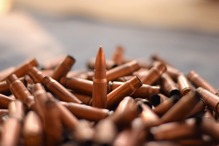 A bunch of fired bullet rounds of a gun / weapon. Recent act of terrorism / killing / genocide / mass murder / shooting against civilians and muslims for ethnic cleansing requires gun laws legislation