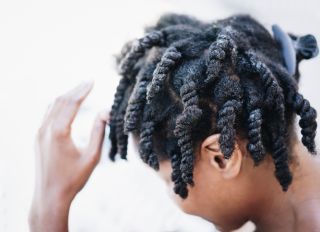 High Angle Close-Up Of Boy Dreadlocks Against White Background