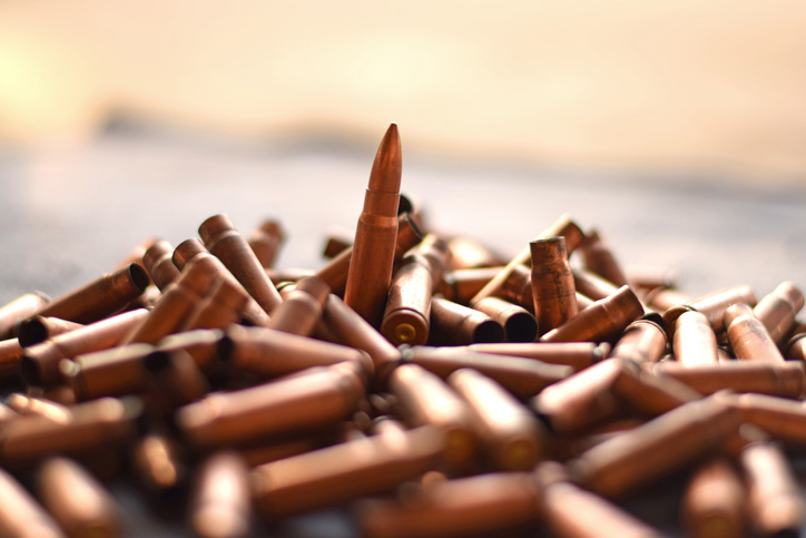 A bunch of fired bullet rounds of a gun / weapon. Recent act of terrorism / killing / genocide / mass murder / shooting against civilians and muslims for ethnic cleansing requires gun laws legislation