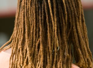 Rear view of woman with dreadlocks