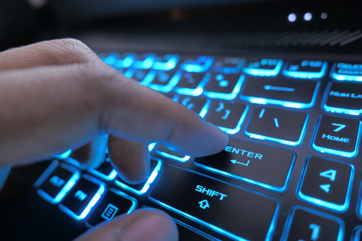 hacker hand typing on keyboard