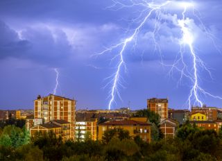 Lightning striking over a city
