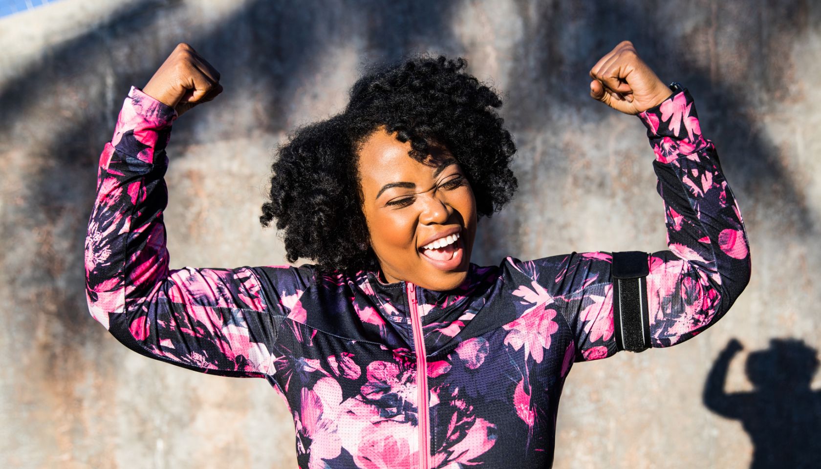 Funny portrait of a young black curvy woman during a training session - stock photo