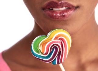 close up of a mouth and lollipop