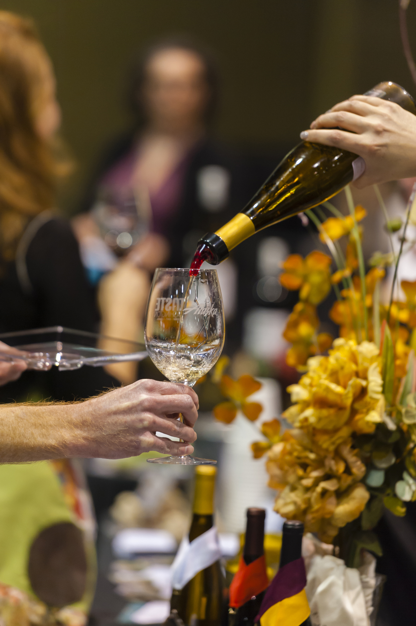 Person pouring wine during Taste of Washington seminars and Grand Tasting, Seattle, Washington State, USA
