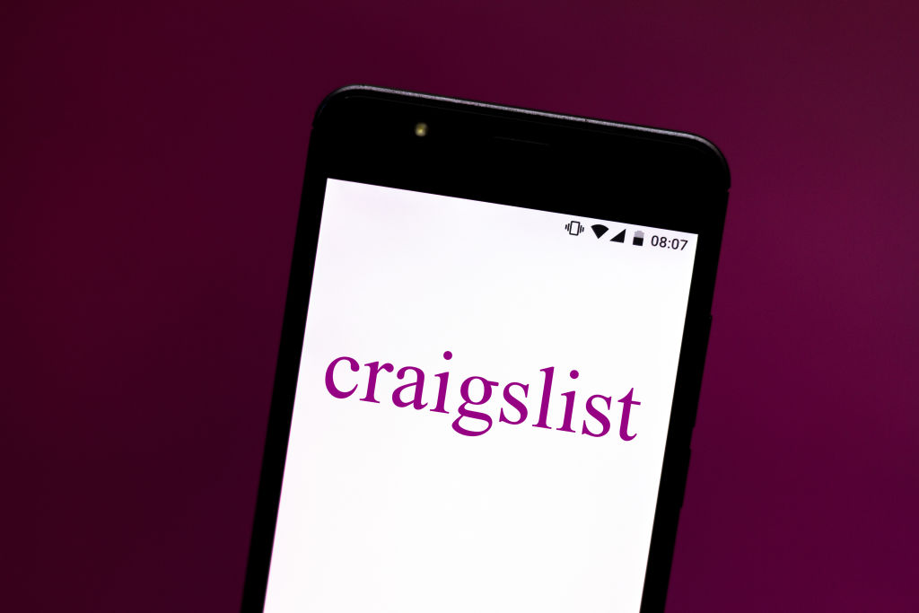 In this photo illustration a Craigslist logo seen displayed...