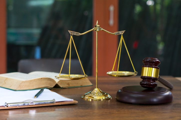 Close-Up Of Justice Gavel Books On Table