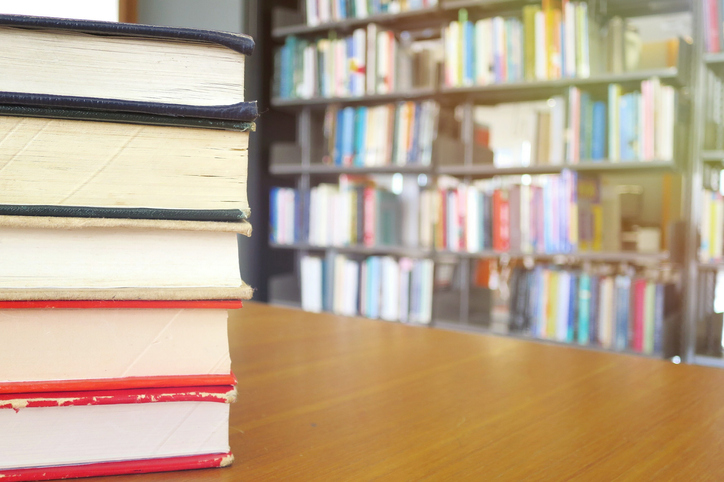 Close-Up Of Books On Table In Library