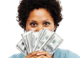 Portrait of an African woman holding US paper currency - stock photo
