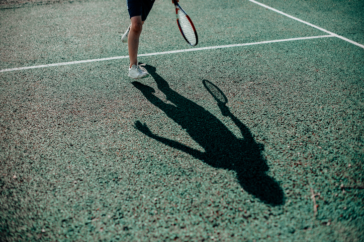 child tennis player shadow