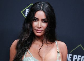 Kim Kardashian West wearing Versace arrives at the 2019 E! People's Choice Awards held at Barker Hangar on November 10, 2019 in Santa Monica, Los Angeles, California, United States.