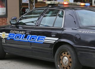 Close-up of a Cleveland police vehicle with flashing lights
