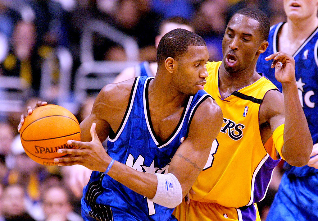 Lakers Kobe Bryant tries to defend the Orlando Magic's Tracy McGrady in the first half at the Staple