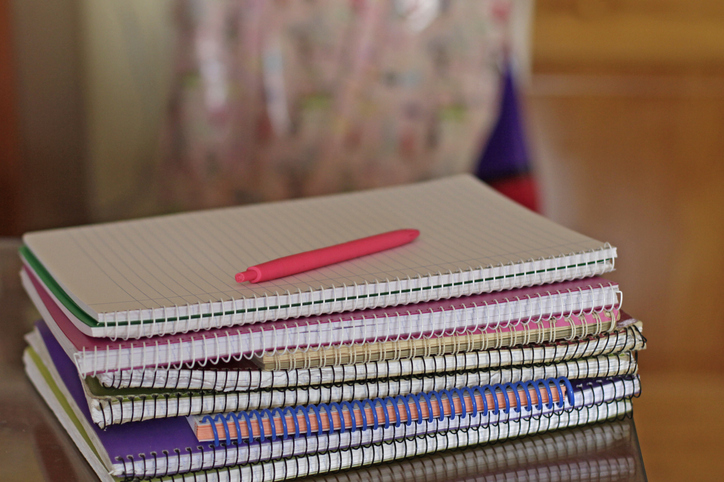 Stacks of notebooks on table