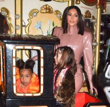 Kim Kardashian West and Kourtney Kardashian ride Eiffel Tower carousel with daughters North West and Penelope Disick
