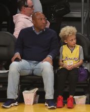 Byron Allen and son Lucas Allen at the Lakers game