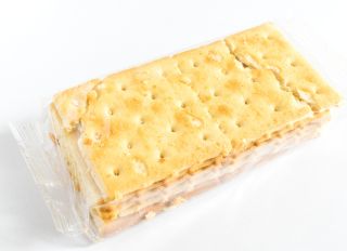 Close-Up Of Cracker Packet Over White Background