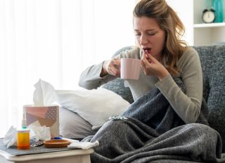 Sick woman with flu at home