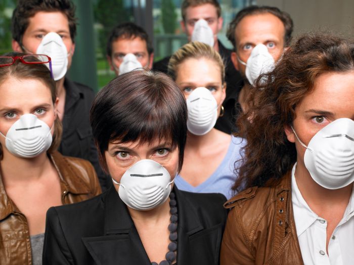 Group of people wearing protection masks - stock photo