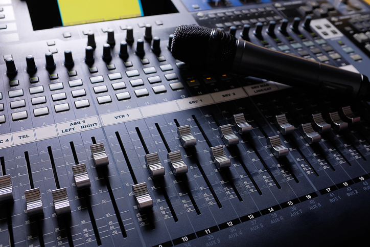 Microphone, Amplifying Equipment, Studio Audio Mixer Knobs And Faders. Workplace And Equipment Of The Sound Engineer. Acoustic Mixing Of Music, Selective Focus.