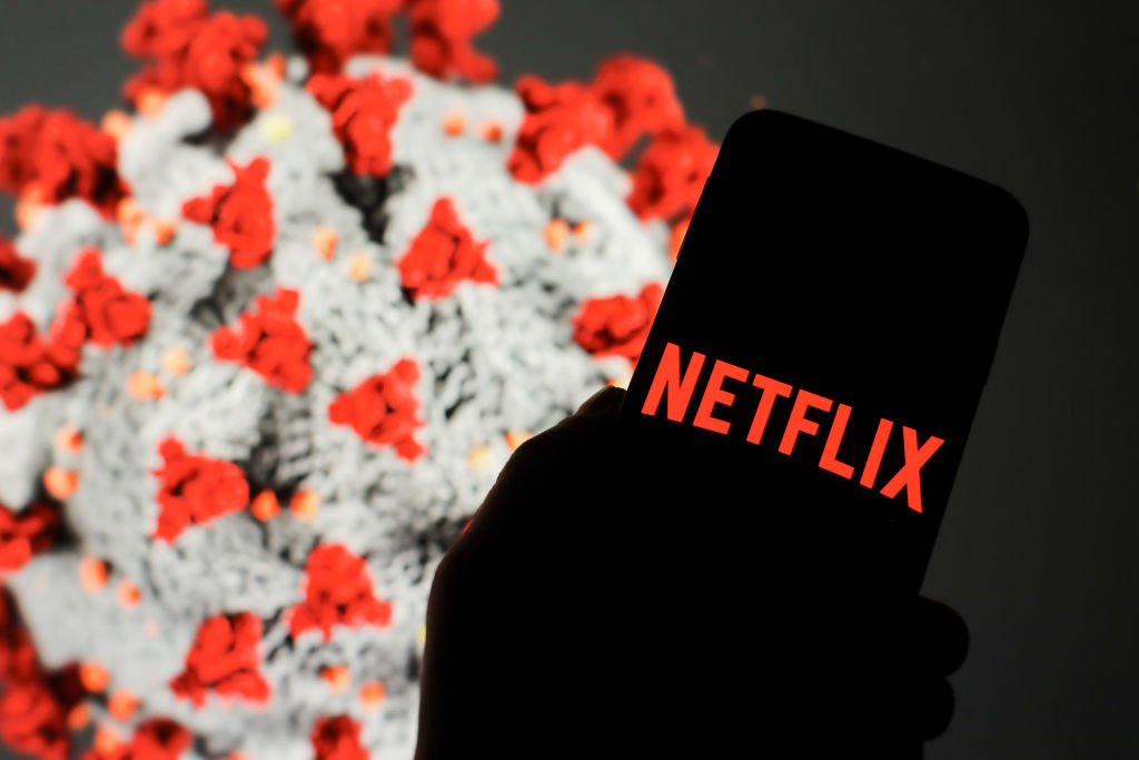 In this photo illustration a Netflix logo seen displayed on...