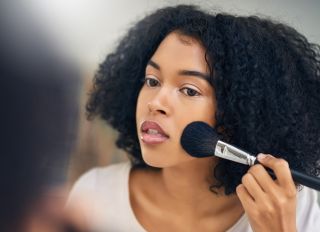 Setting the foundation for flawless makeup - stock photo