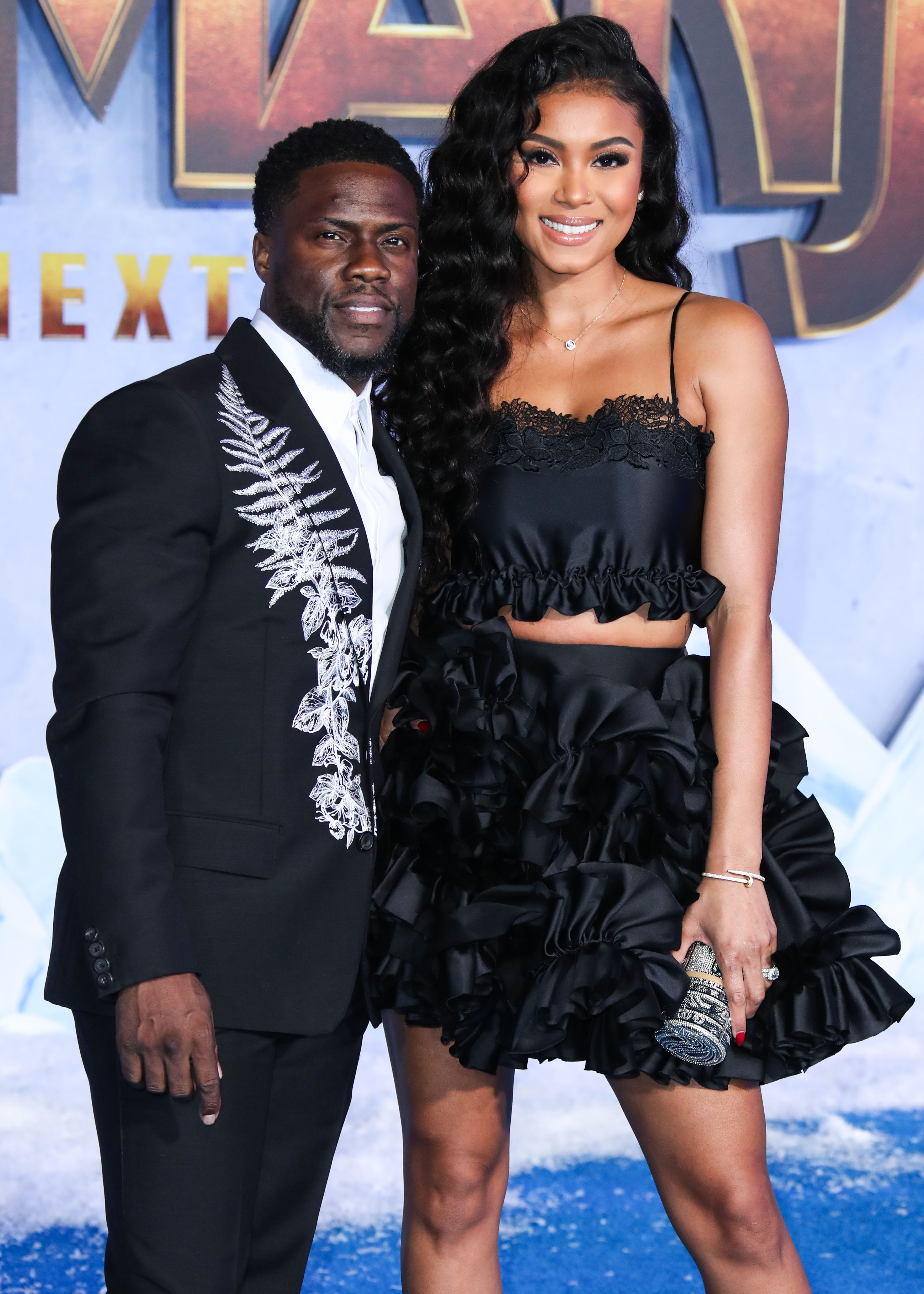 Kevin Hart and Eniko Hart at his premiere for Jumanji