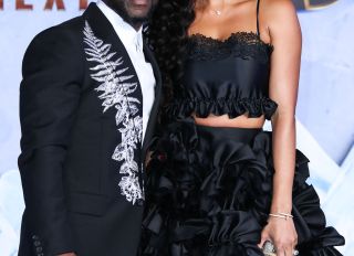 Kevin Hart and Eniko Hart at his premiere for Jumanji