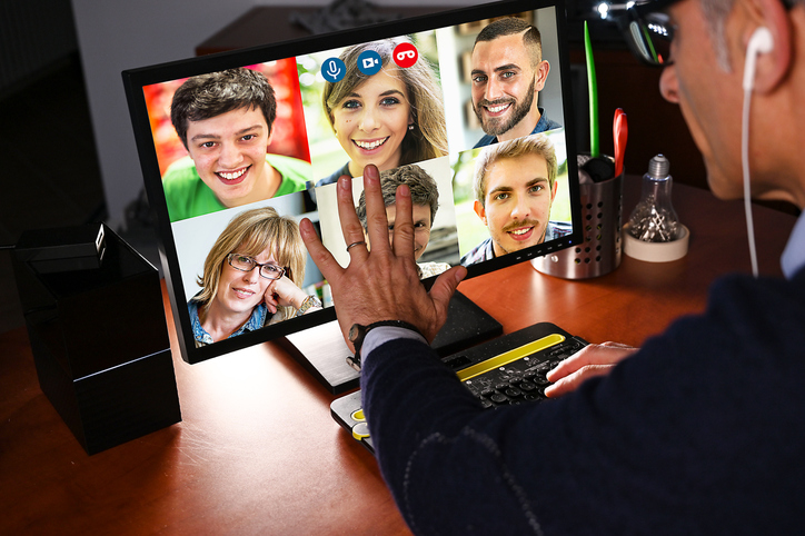 Man Video Chatting with a group of people