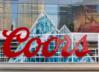 An advertisement logo for Coors beer. The branding design is...